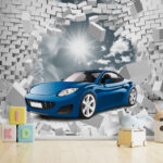 Fotobehang Blauwe auto scheurt door bakstenen muur.