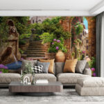 Fotobehang Stenen pad met fontein en trappen en bloemen