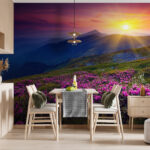 Fotobehang Bloemenveld met daarachter de ondergaande zon