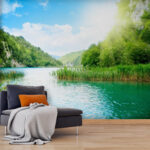 Fotobehang Waterlichaam met gras en bomen eromheen
