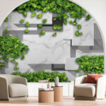 Fotobehang Groene bladeren op geometrisch marmerdessin.