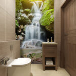 Fotobehang Serene waterval te midden van weelderig groen.