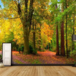 Fotobehang Kleurrijk herfstbos met kronkelend pad.