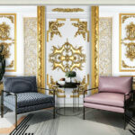 Fotobehang Witte en gouden muur met sierlijke ontwerpen