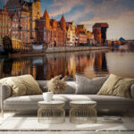 Fotobehang Waterlichaam met gebouwen en boten erin