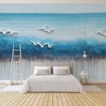 Fotobehang Schilderij van vogels vliegend over een blauwe oceaan