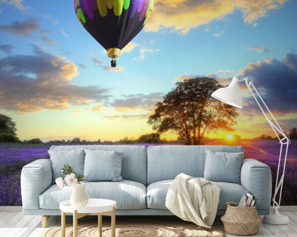 Groep heteluchtballonnen vliegend over een veld met bloemen Fotobehang Groep heteluchtballonnen vliegend over een veld met bloemen