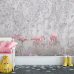 Fotobehang Groep roze flamingo's in een vijver met bloemen