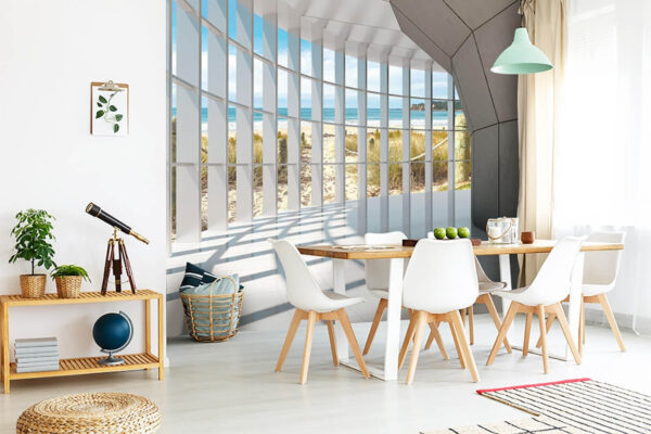 Fotobehang Zonnig uitzicht op het strand door geometrische ramen