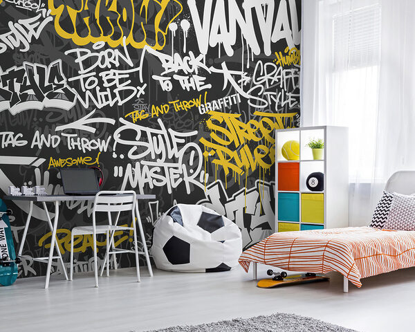 Gele graffiti op zwarte achtergrond Fotobehang Gele graffiti op zwarte achtergrond