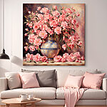 Canvas Schilderijen Roze bloesems in een vaas van keramiek.