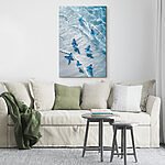 Canvas Schilderijen Groep blauwe vlinders drijvend op water