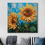 Canvas Schilderijen Zonnebloemen bloeien tegen een blauwe achtergrond