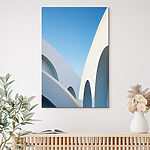 Canvas Schilderijen Wit gebouw met een blauwe lucht