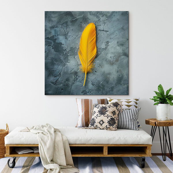 Gele veer op een grijs oppervlak Canvas Schilderijen Gele veer op een grijs oppervlak