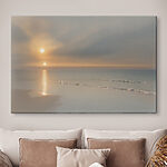 Canvas Schilderijen Zonsondergang boven een strand