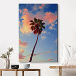Canvas Schilderijen Palmboom met blauwe lucht en wolken