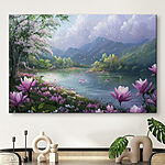 Canvas Schilderijen Rivier met bloemen en bergen op de achtergrond