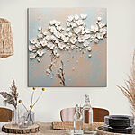 Canvas Schilderijen Witte bloemen op een blauw en wit oppervlak