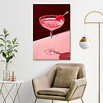 Canvas Schilderijen Glas met roze vloeistof en twee kersen erop