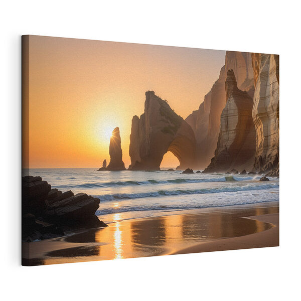 Canvas Schilderijen Zonsondergang over een strand met rotsen en water