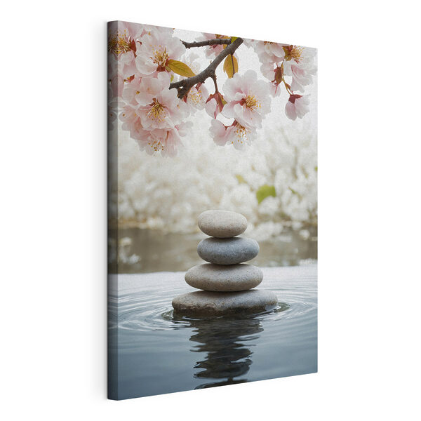 Canvas Schilderijen Een stapel stenen in het water met bloemen op de achtergrond