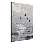 Canvas Schilderijen Vogels die boven het water vliegen