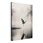 Canvas Schilderijen Vogel die over het water vliegt