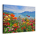 Canvas Schilderijen Bloembed met bloemen en een meer op de achtergrond