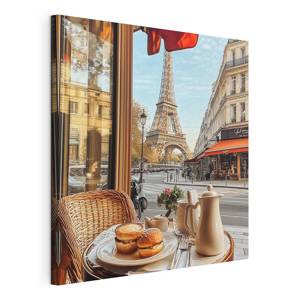 Canvas Schilderijen Tafel met eten erop en een tafel met een toren op de achtergrond