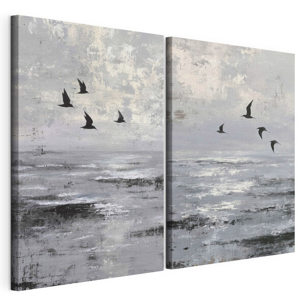 Modulaire canvasprint Een groep vogels die over het water vliegt